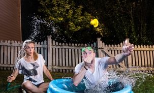 alec and martha jump in mini pool with rubber duckie