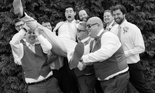 groom-carried-by-groomsmen