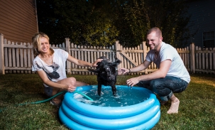 alec and martha bathe dogs in mini pool