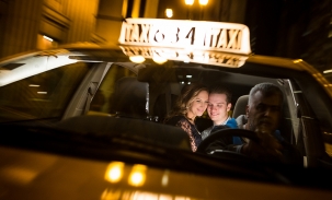 ally and nick riding in back of taxi cab